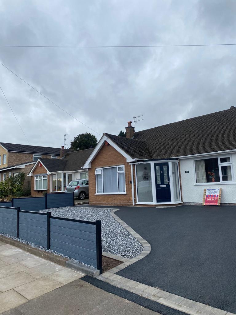 Freshly laid tarmac driveway with block paved edging in Stoke-on-Trent